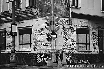 Ghetto street of the city painted graffiti. Dirty walls in the inscription Traffic light stop sign Artistic or Social Photography. Editorial Stock Photo