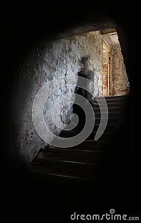 Ghost figure on stairs Stock Photo