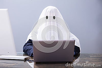 Ghostwriter Writing Article On Laptop Stock Photo