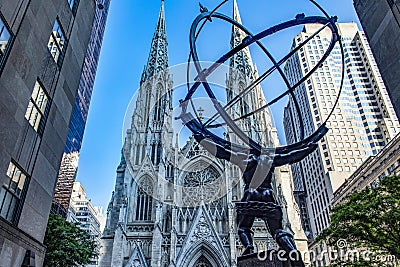 The giant Atlas holding the planet earth as a punishment of the gods, on the fifth avenue of the big apple in front of St. Patrick Editorial Stock Photo