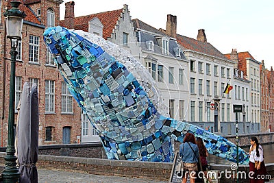 Giant blue whale jumps out of the canal in Bruges Editorial Stock Photo