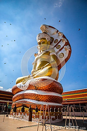 Giant Buddhawith Naga serpent temple in Singburi, Thailand Stock Photo