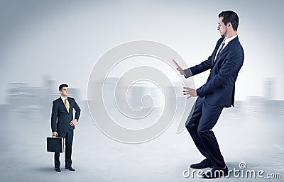 Giant businessman is afraid of small executor Stock Photo