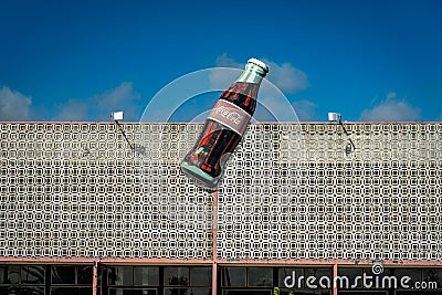 Badajoz, Spain - Giant drink bottle sign on a closed Coca-Cola factory Editorial Stock Photo