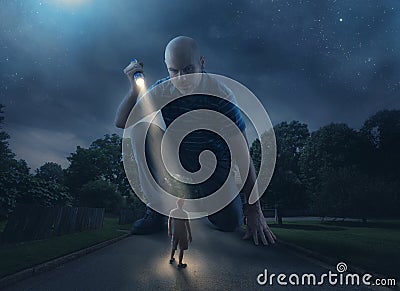 Giant with flashlight Stock Photo