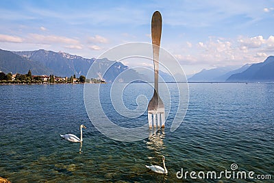 Giant fork in water of Geneva lake. Vevey, Switzerland Editorial Stock Photo