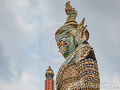 Giant The front of gate with Cloud sky in Wat phrakaew Temple Bangkok Stock Photo
