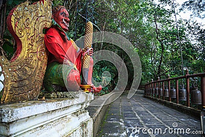 Giant Gate Guardian at temple entrance to Wat Phra That Doi Tung, Chiang Rai, Thailand. Thai Travel Tourism Stock Photo