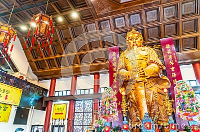 The giant golden statue of Che Kung in Che Kung Temple, Hong Kong Editorial Stock Photo
