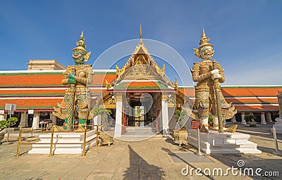 Giant guardian statue of Golden pagoda at Temple of the Emerald Buddha in Bangkok, Thailand. Wat Phra Kaew and Grand palace in old Stock Photo