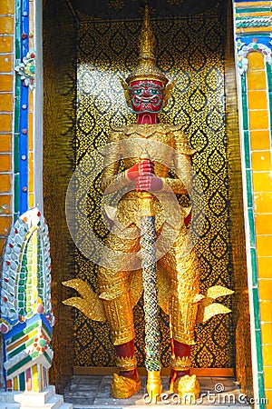 Giant guarding the entrance to the Phra Mondop temple in Thailand Stock Photo