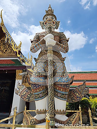 The giant guarding the temple's door at Wat Phra Kaew.The second one has a name,SAHASSADEJA, Stock Photo