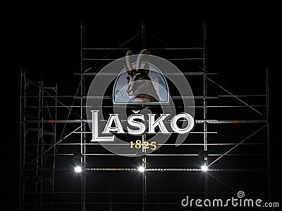Giant logo of Lasko Pivo Beer on a summer outdoor bar. Lasko is a Slovenian light lager beer, the biggest producer of Slovenia Editorial Stock Photo