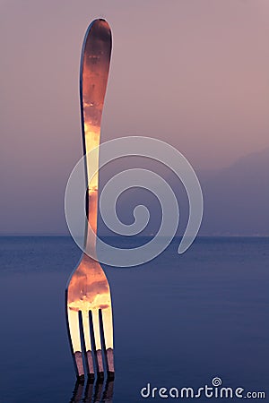 Giant Metal Fork Planted in Lake Leman in front of Food Museum in Vevey Editorial Stock Photo
