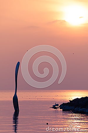 Giant Metal Fork Planted in Lake Leman in front of Food Museum in Vevey Editorial Stock Photo