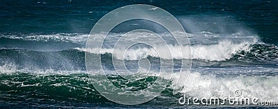 Giant ocean waves crashing in a storm out at sea Stock Photo