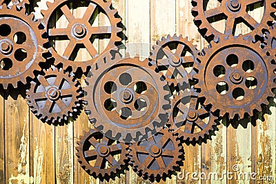 GIANT OLD AND RUSTY COGWHEELS ON THE WALL Stock Photo