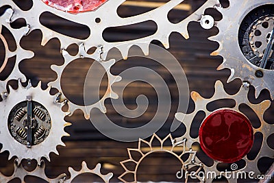 GIANT OLD AND RUSTY COGWHEELS WITH WOODEN BACKGROUND Stock Photo