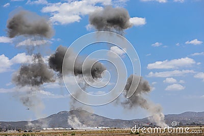 Giant outdoors explosion with fire and black smoke Stock Photo