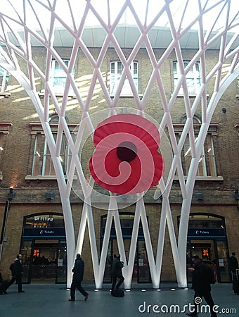 Giant poppy at kings cross station london Editorial Stock Photo