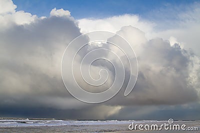 Giant rain clouds above the sea Stock Photo