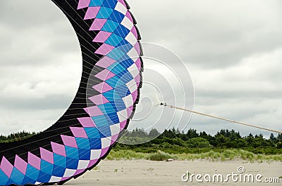 Giant ring shaped kite on net of cables Stock Photo