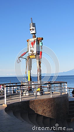 Giant robot figure on the beach at Puerto Varas Editorial Stock Photo