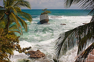 Giant rock in ocean near by Costarican coast Stock Photo