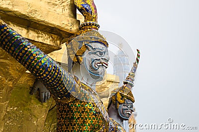 Giant Statue Surround The Basement of Grand Gold Stupa Is One of Landmark of Wat Phra Kaew Monastery, Bangkok of Thailand. Stock Photo