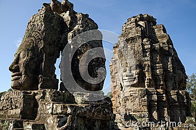 Giant stone faces of Bayon temple in Angkor Thom Stock Photo