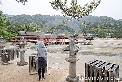 Giant Torii during low tide near Itsukushima shinto shrine Editorial Stock Photo