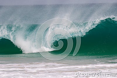 Giant wave hits the shore Stock Photo