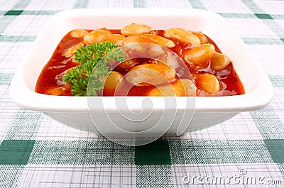 Giant white beans in tomato sauce and parsley Stock Photo