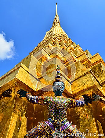 Giants under golden pagoda Stock Photo