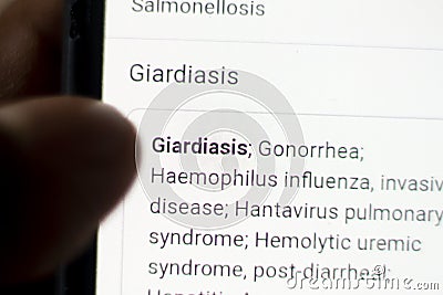 Giardiasis News on the phone.Mobile phone in hands. selective focus and chromatic aberration effects Stock Photo