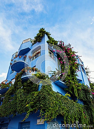 Giardini Naxos blue hotel covered in greenery, Sicily Stock Photo