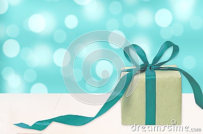 Gift box against bokeh background. Holiday present. Festive gift Stock Photo