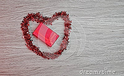 Gift box with heart-shaped decoration Stock Photo