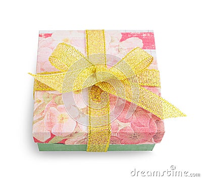Gift box with festive floral prints and golden ribbon bow Stock Photo