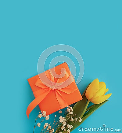 Gift box flower tulip on colored background birthday Stock Photo