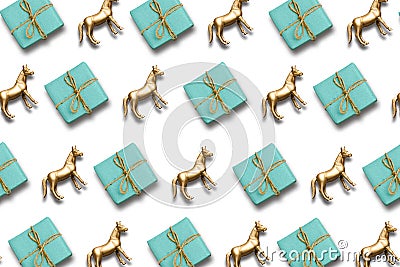 Gift box and gold horse pattern composition. christmas or holiday background Stock Photo