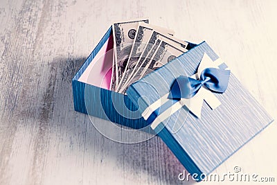 Gift box lies money. give money Stock Photo