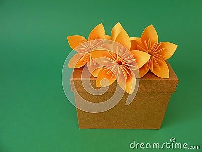 Gift box and origami flowers Stock Photo