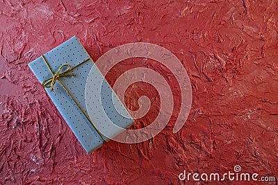 Gift box on Peach color rough background Stock Photo