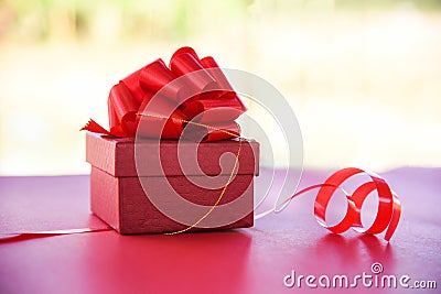 Gift Box red top view nature red present box with red ribbon bow for gift to Merry Christmas Holiday Happy new year or Valentines Stock Photo