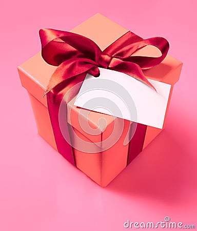 Gift box with ribbon and empty label Stock Photo