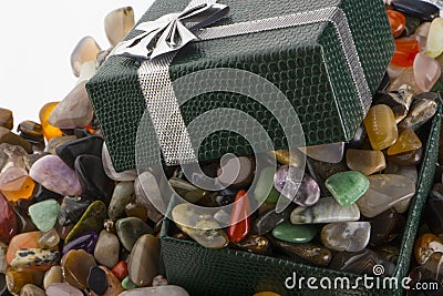 Gift box with semiprecious stones close-up Stock Photo