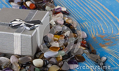 Gift box with semiprecious stones close-up Stock Photo