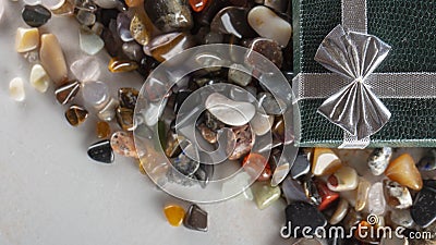 Gift box with semiprecious stones close up Stock Photo