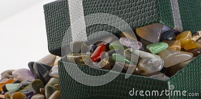 Gift box with semiprecious stones close-up Stock Photo